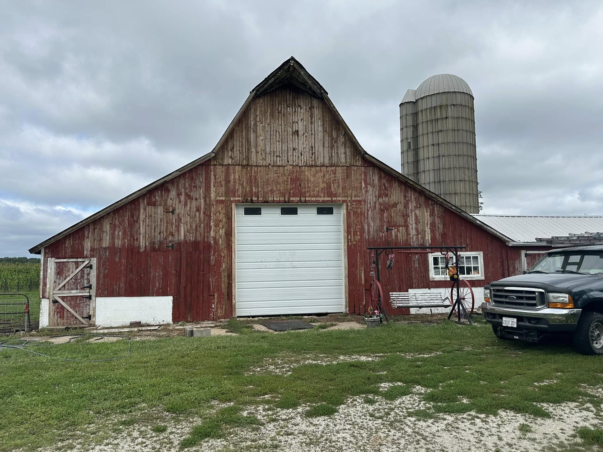 Barn before painting, faded exterior.