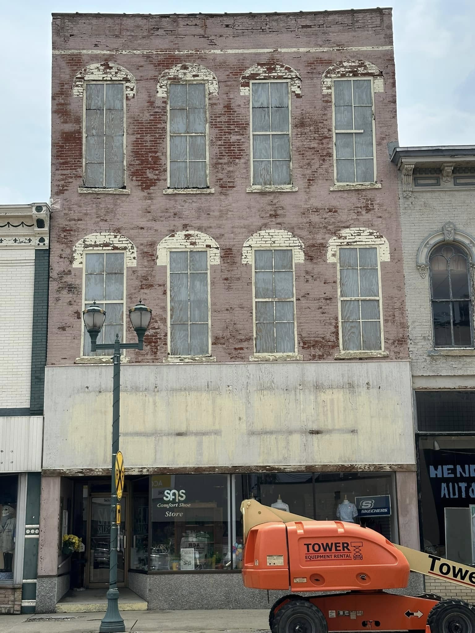 House exterior before painting, worn siding.